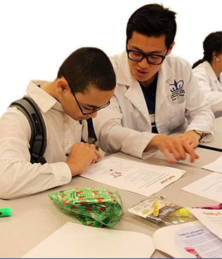 CSUF pre-health postbacc dental alum Evan Chang and student