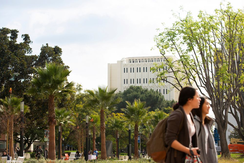 Students walk by at Cal State Fullerton's campus. 